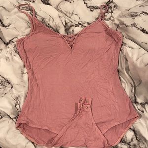 Pale pink spaghetti strap bodysuit